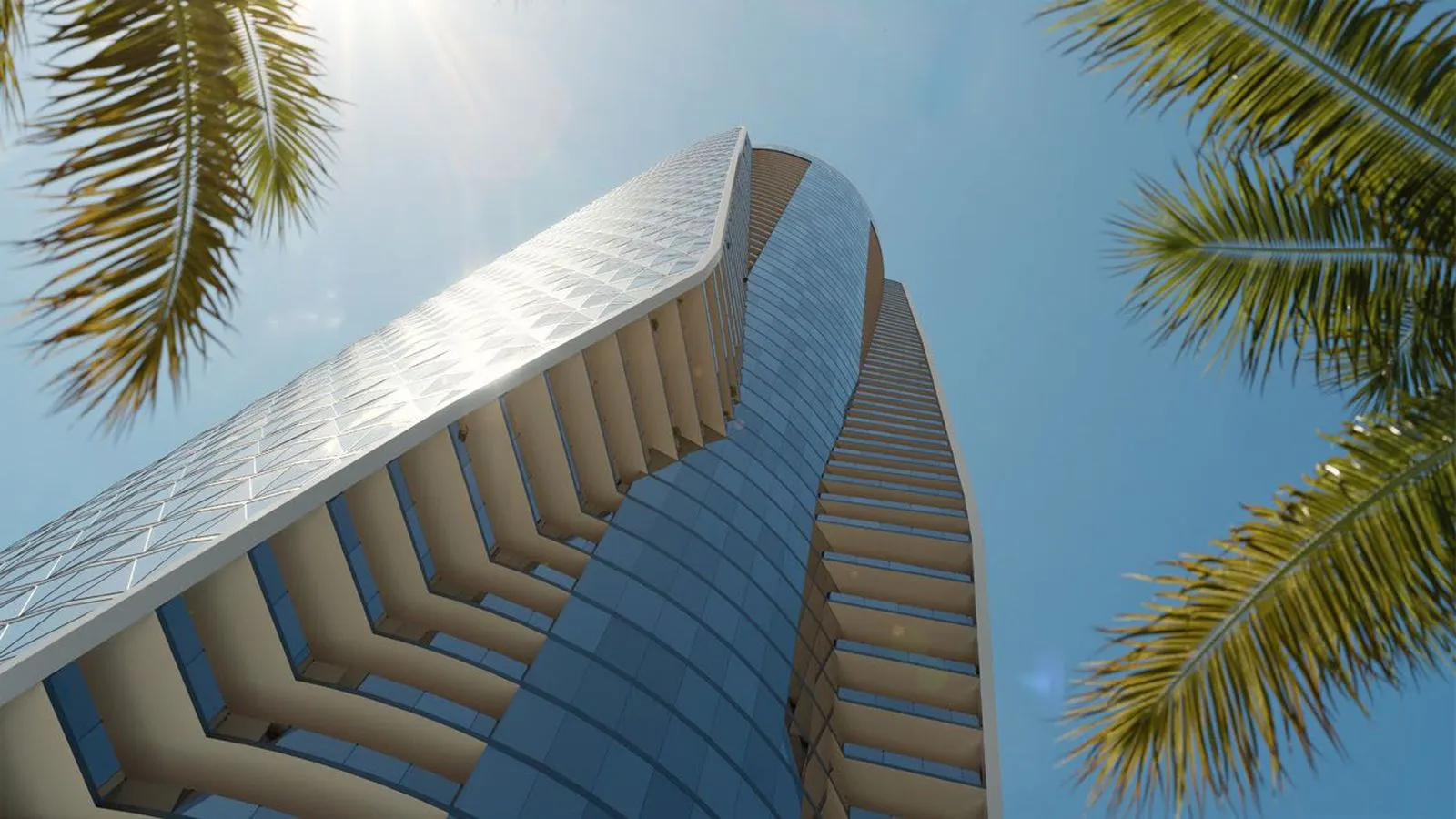 Bentley Residences tower in Sunny Isles Beach seen from below among palm trees